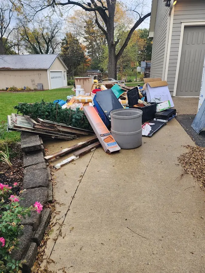 Dumpster being loaded with debris for Residential Dumpster Rental in Lakeside
